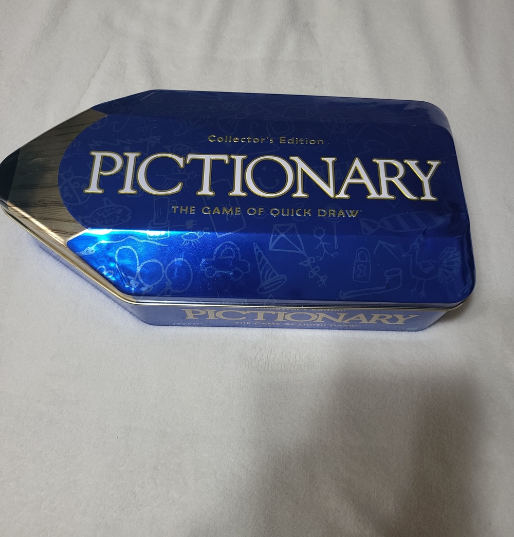 Pictionary Collector's Edition Game Tin - Blue. New. Small Dent On Lid.